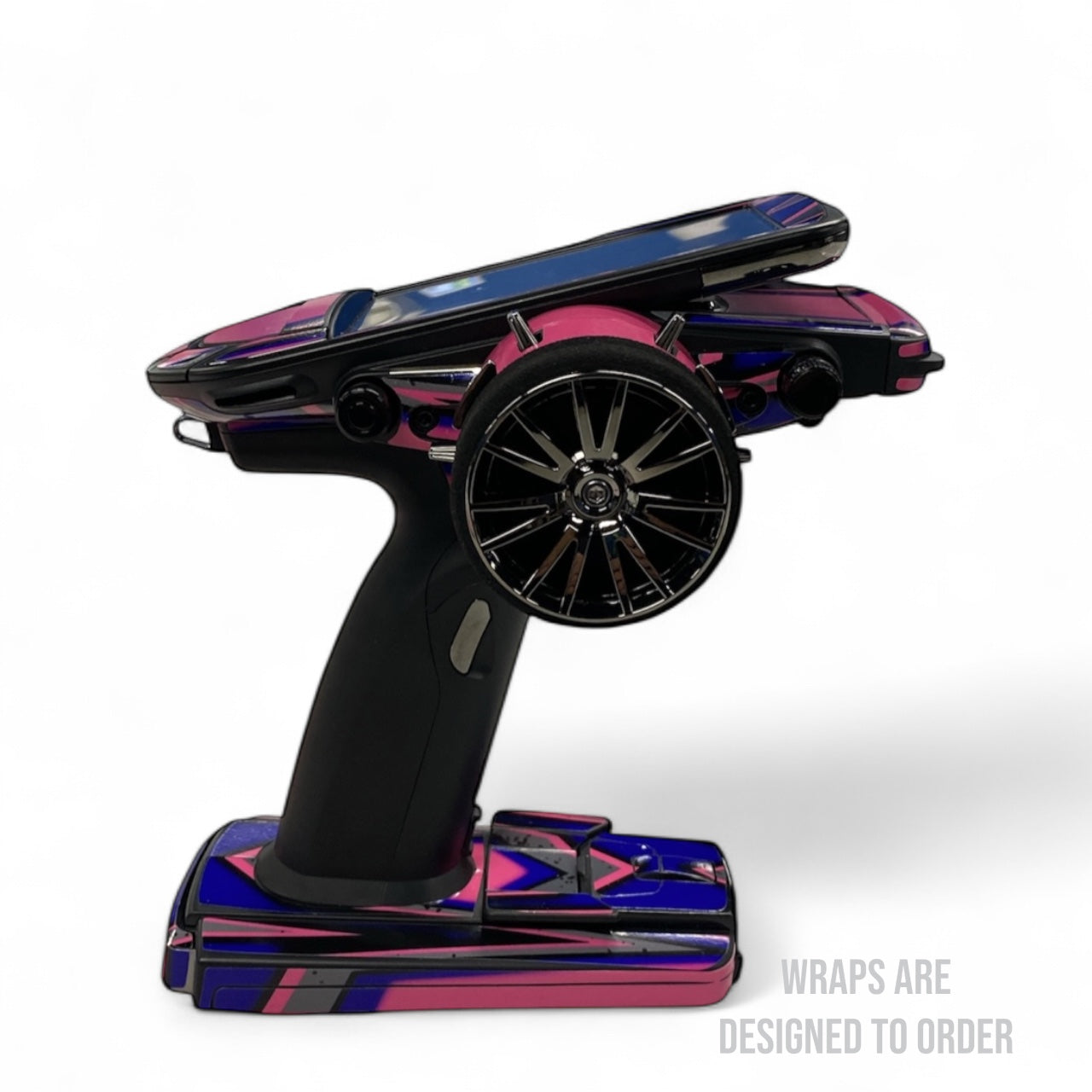 Colorful rc controller with custom wheel design on a white background