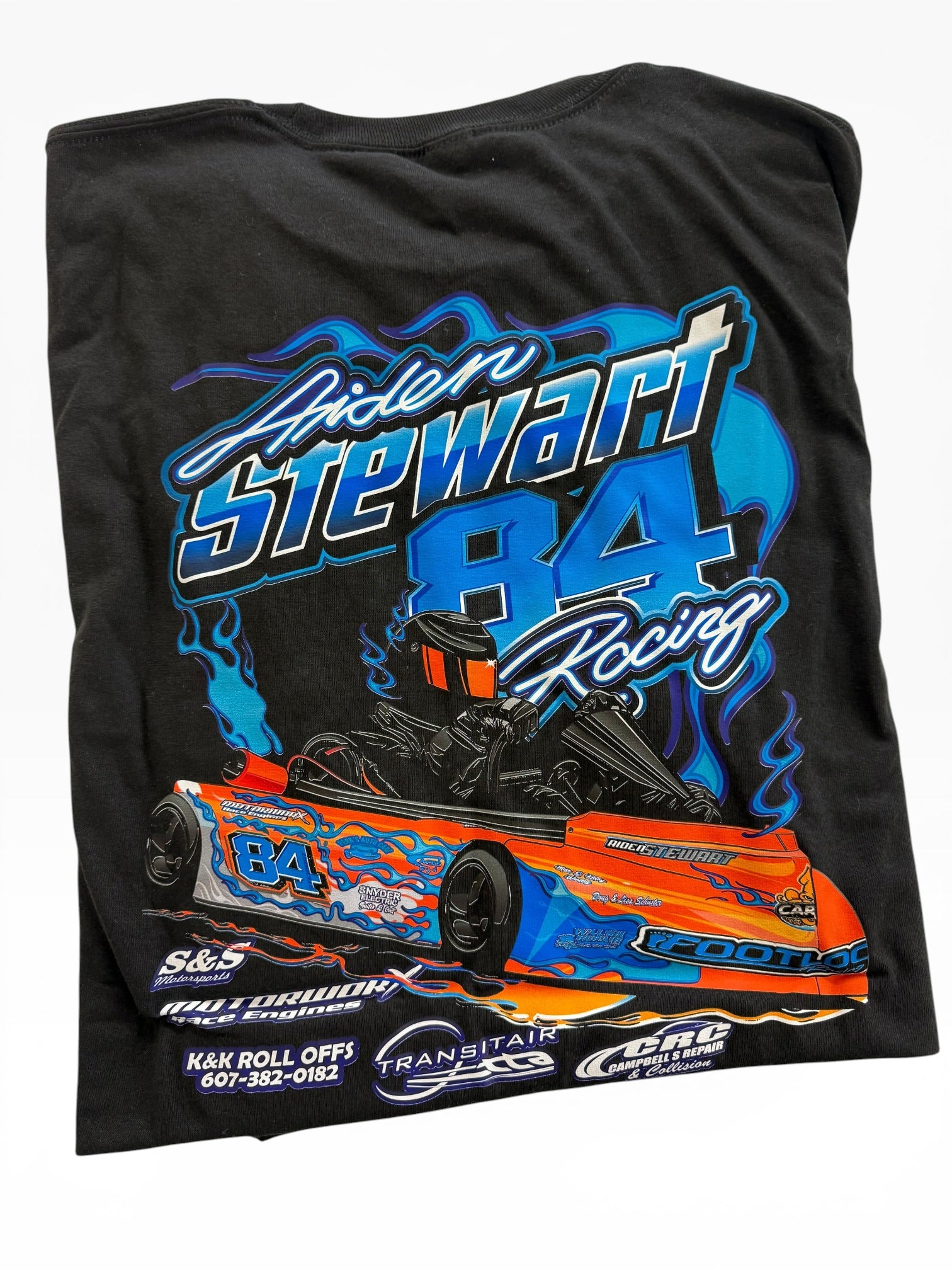 Black t-shirt with race car graphic and text on a white background