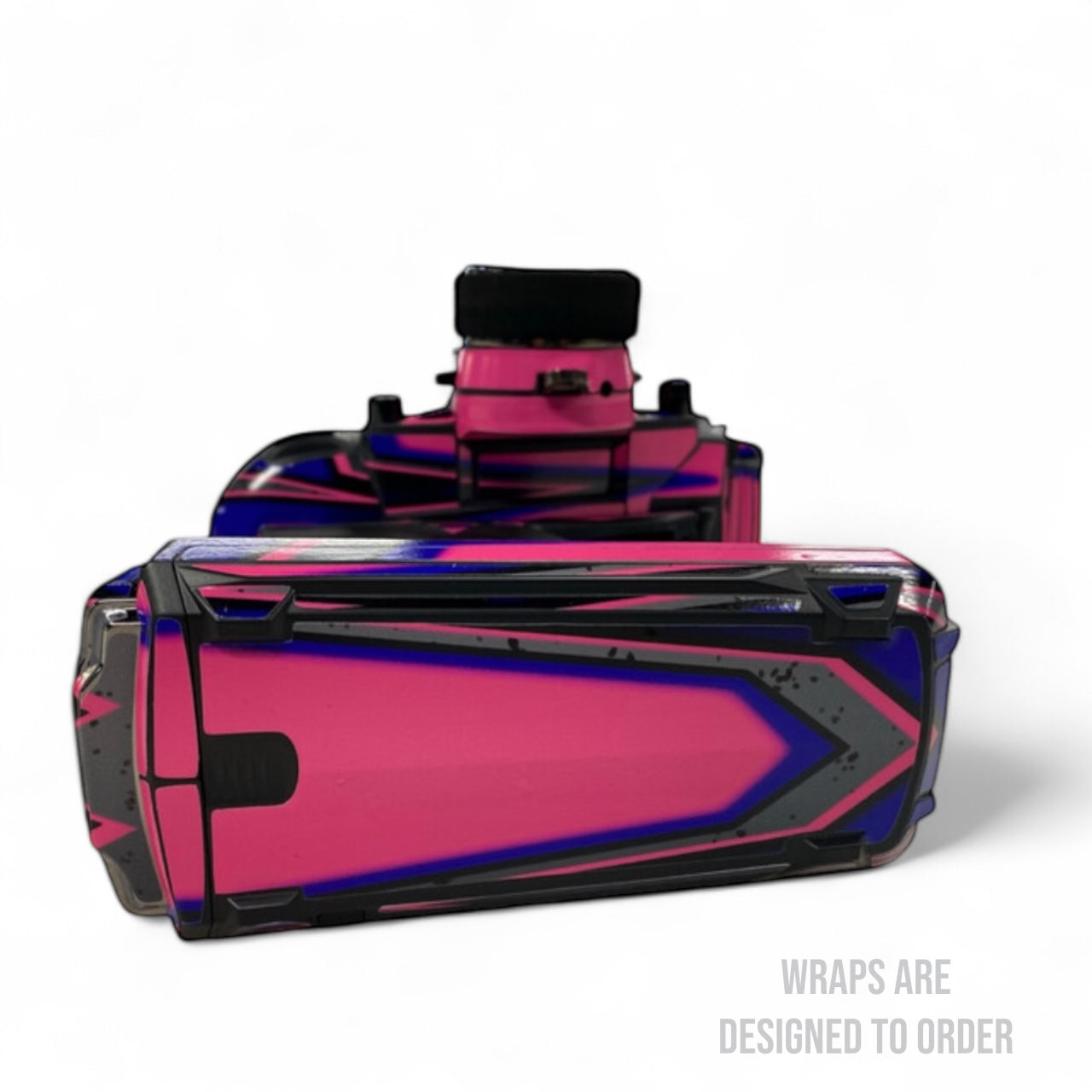 Pink and black controller with a glossy finish on a white background