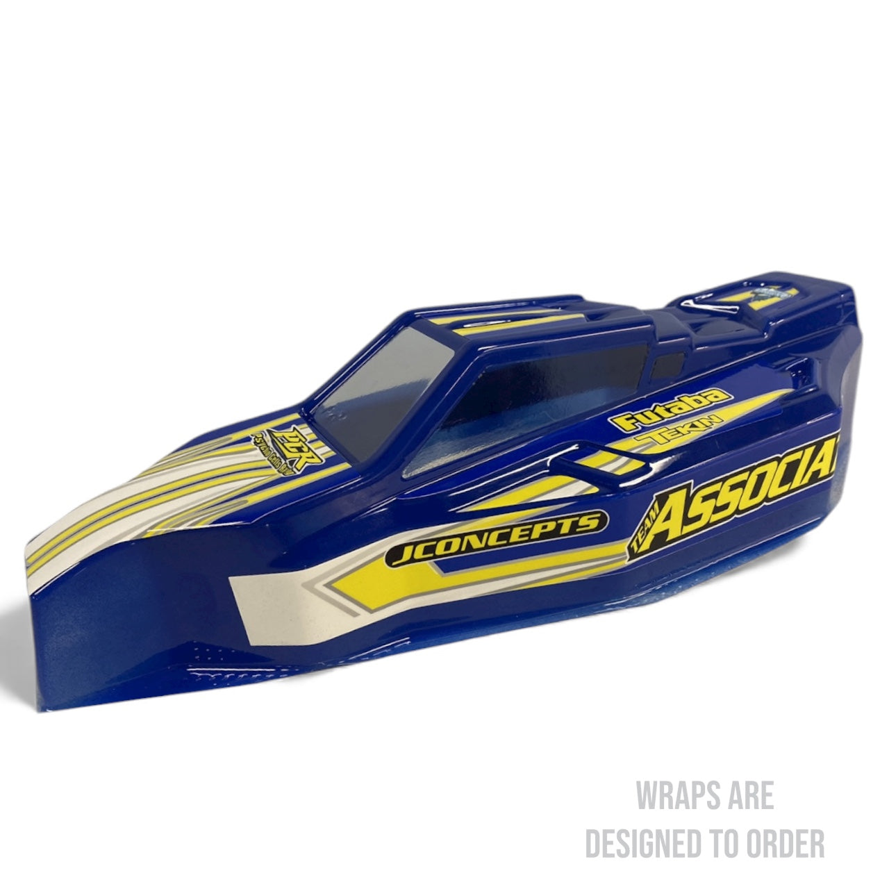 Blue and yellow RC car body with 'JConcepts' and 'Associa' branding on a white background.