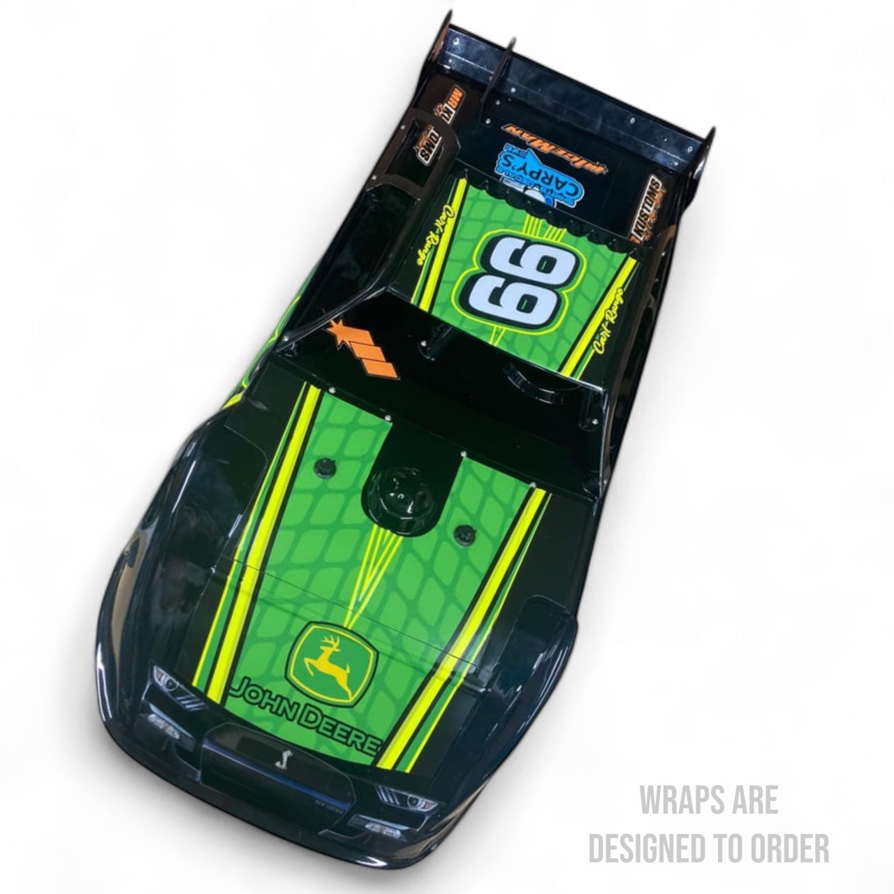 black race car with green and yellow wrap on a white background