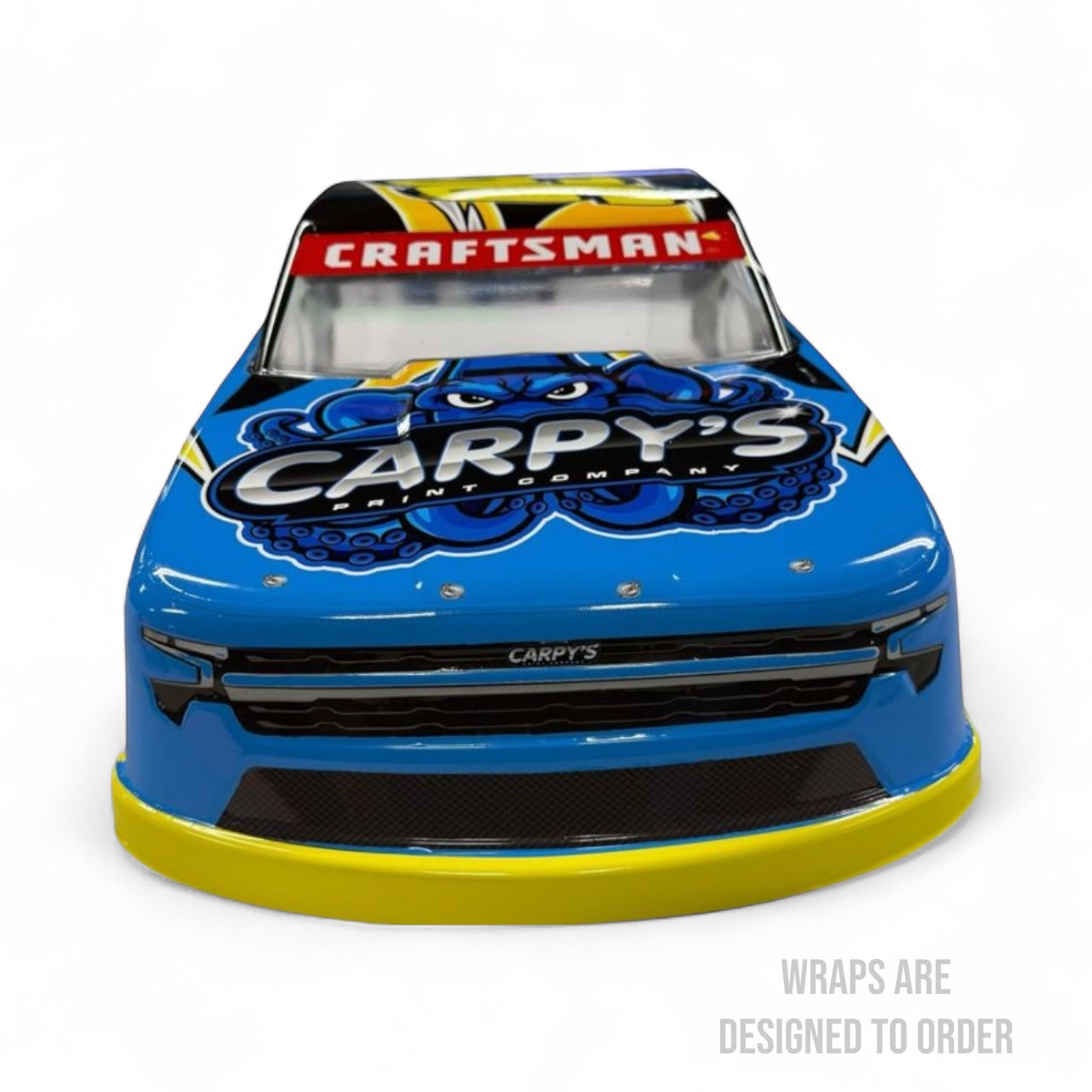 Blue car with 'Carpy's' and 'Craftsman' branding on a white background