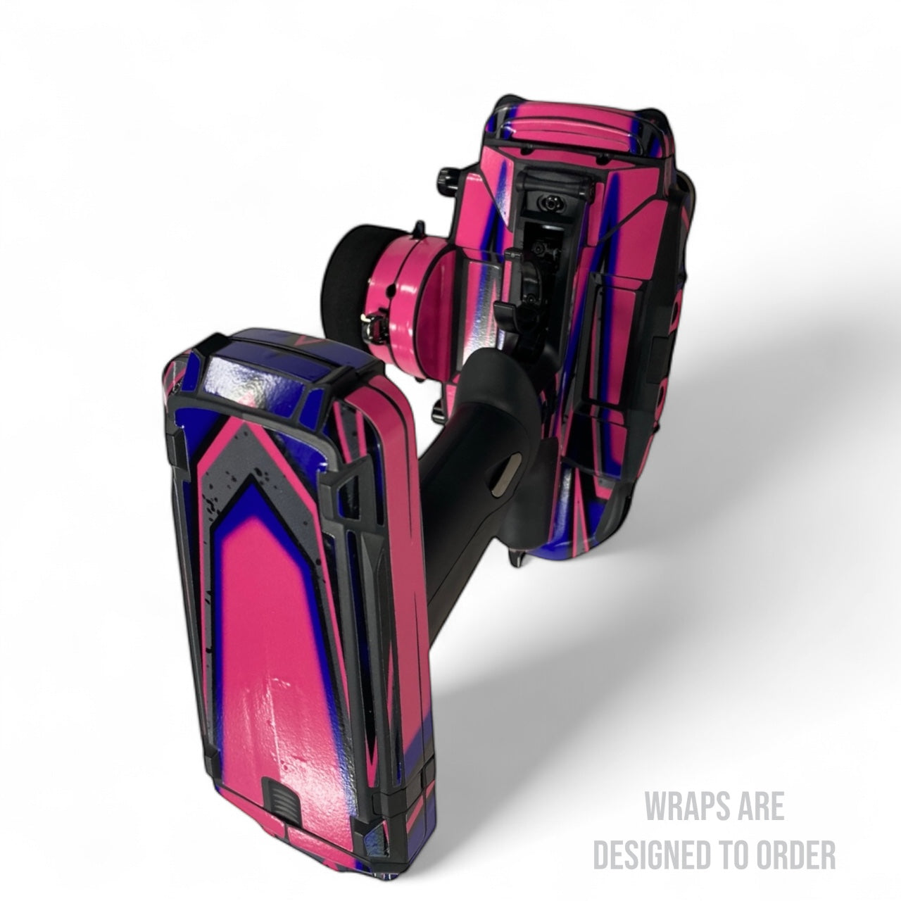Pink and purple rc radio with black accents on a white background