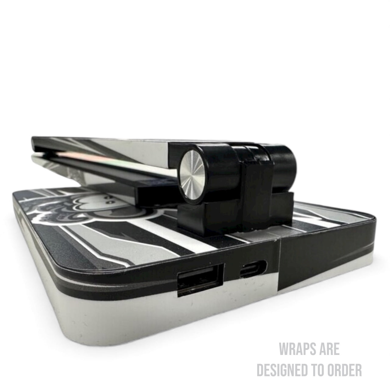Black and silver pit light on a white background